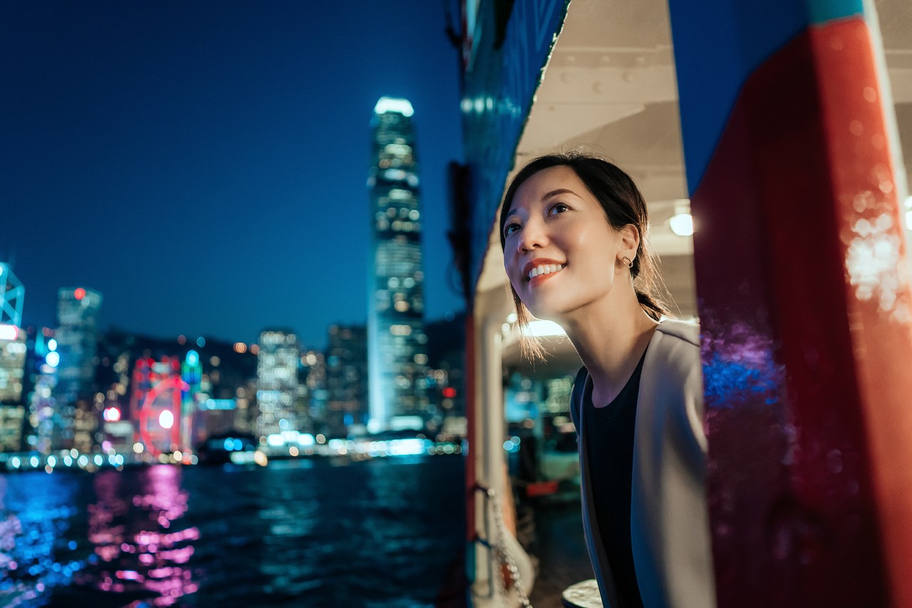 Asian woman looking night city