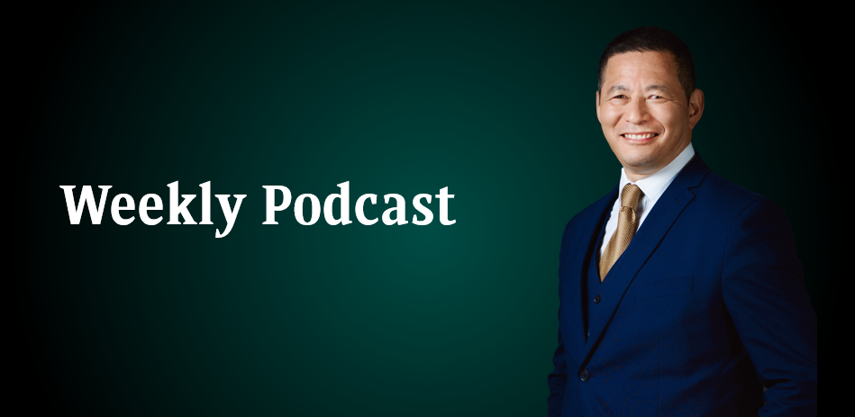 a man smiling wearing a suit